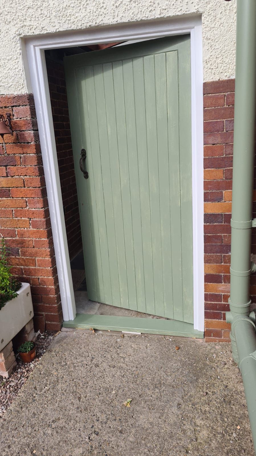 Door after restoration in sage