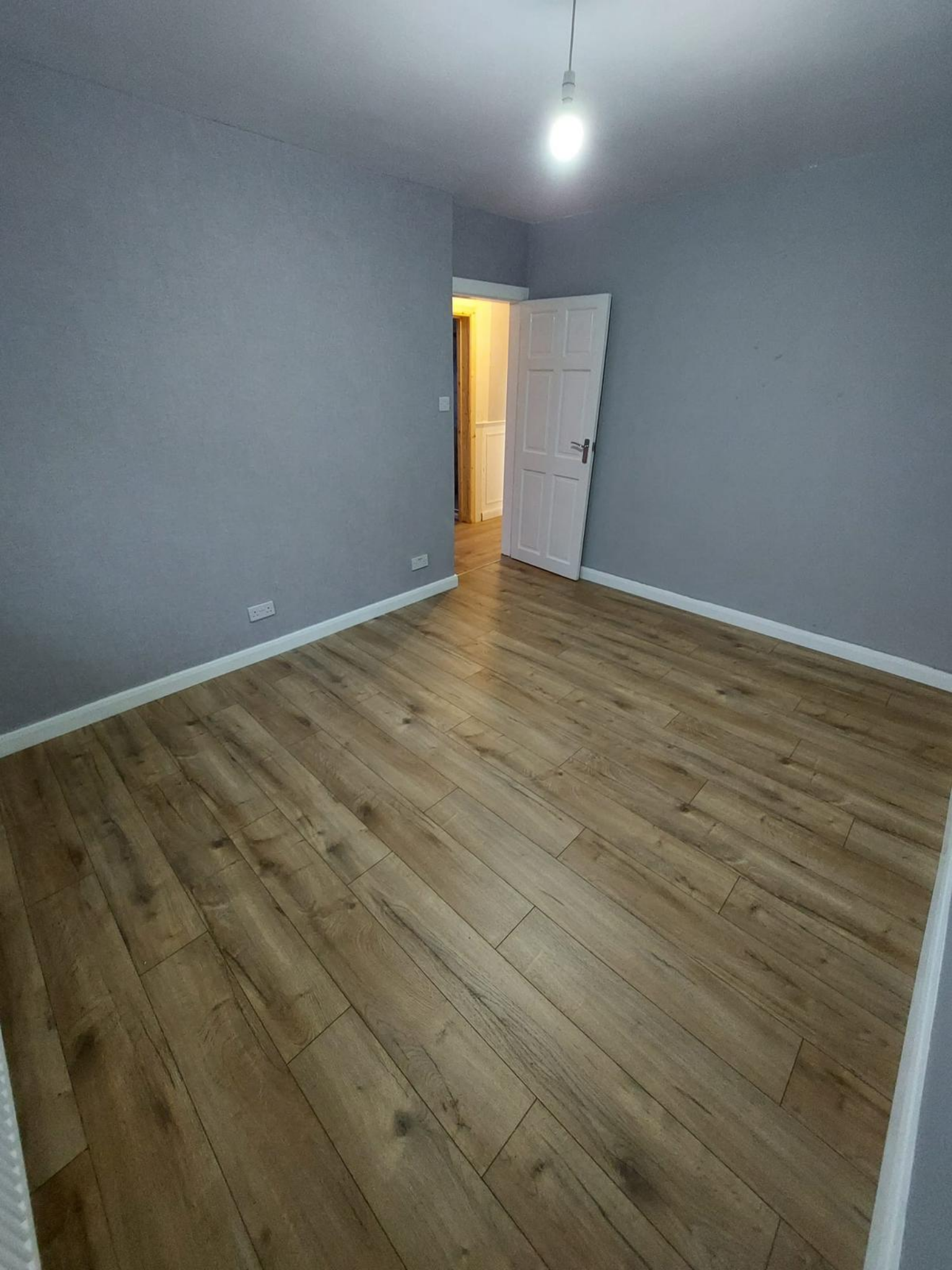 Finished laminate flooring in refurbished room