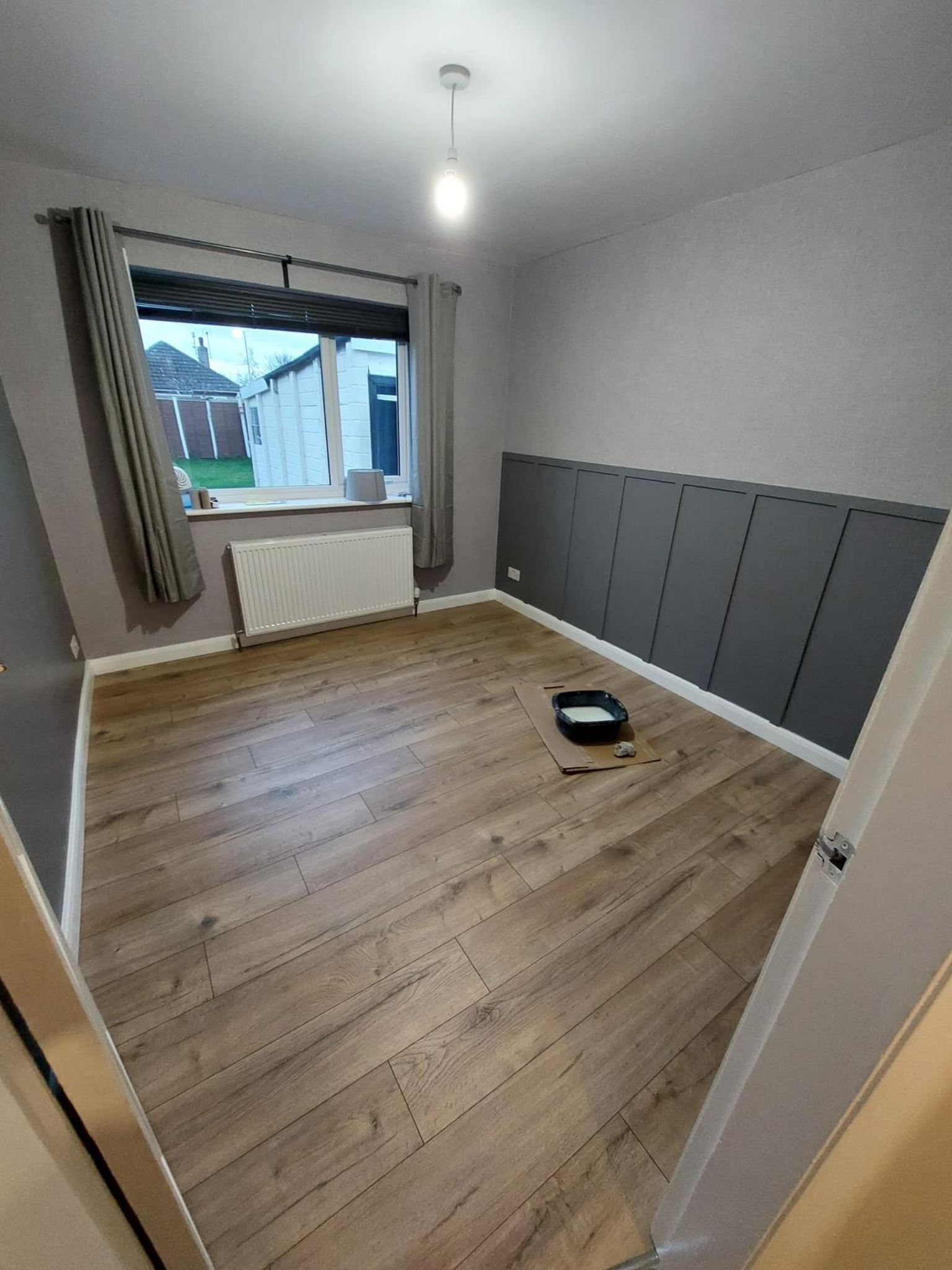Completed room with flooring and wall panelling